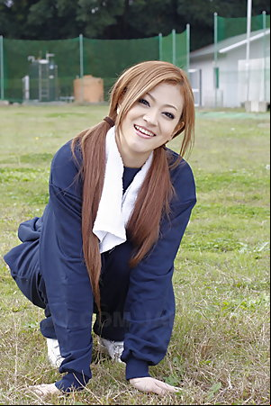 Long haired An Umemiya poses outdoor on field